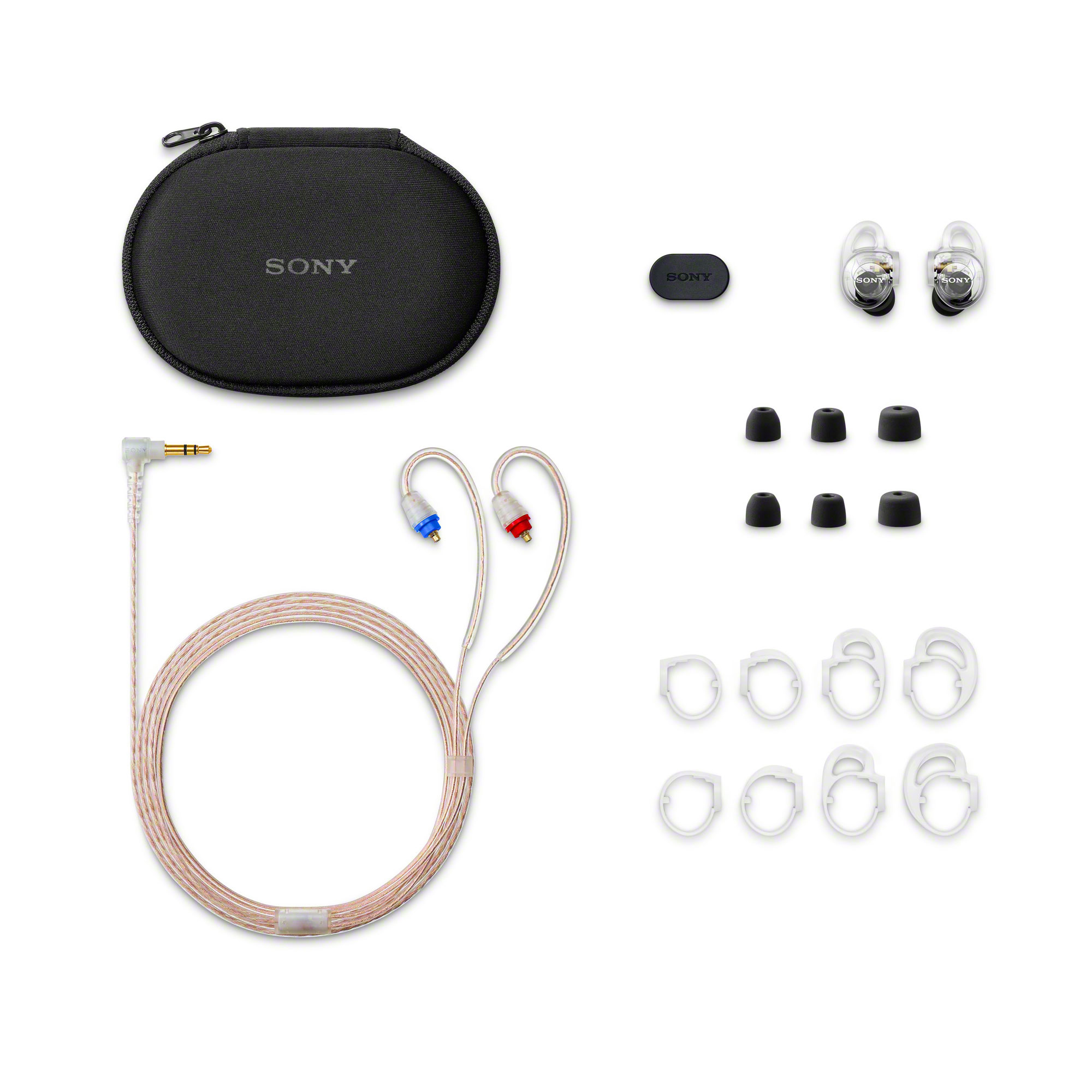 透明色 Sony 耳塞式耳機的內容物，展示收納盒、耳機本體、耳機線、耳塞和多款耳掛配件